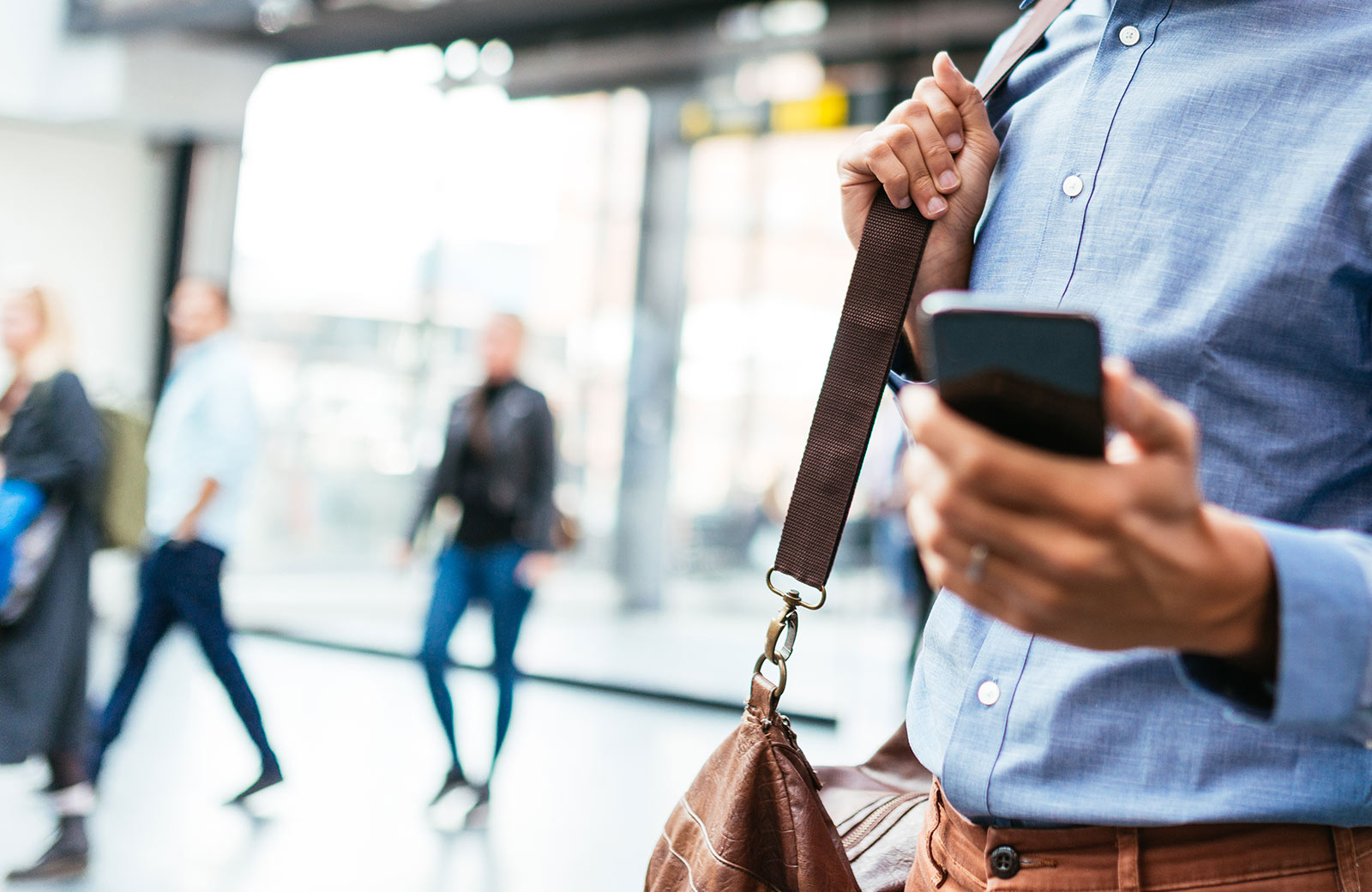 Traveling man looking at phone.